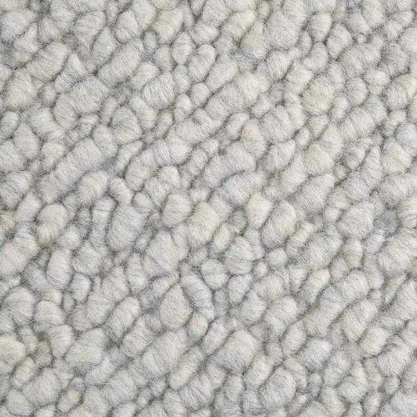 Close-up of light gray tufted carpet texture