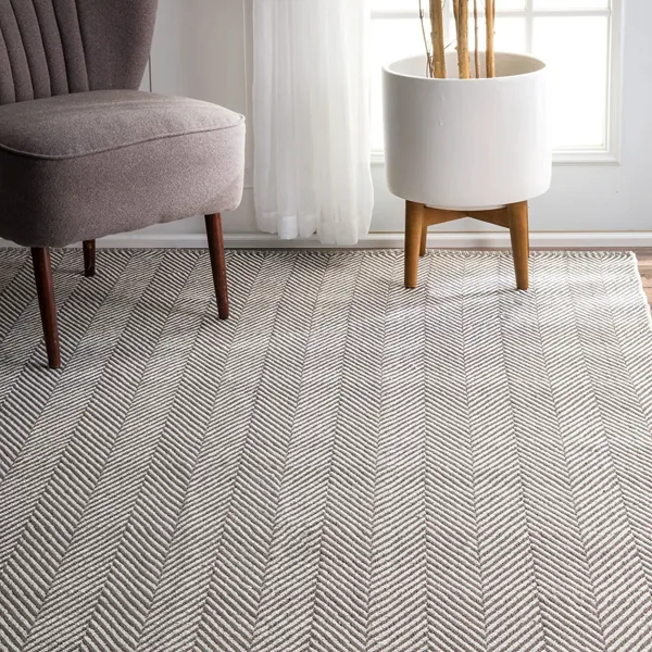 Durable berber wool carpet with a grey and white chevron pattern