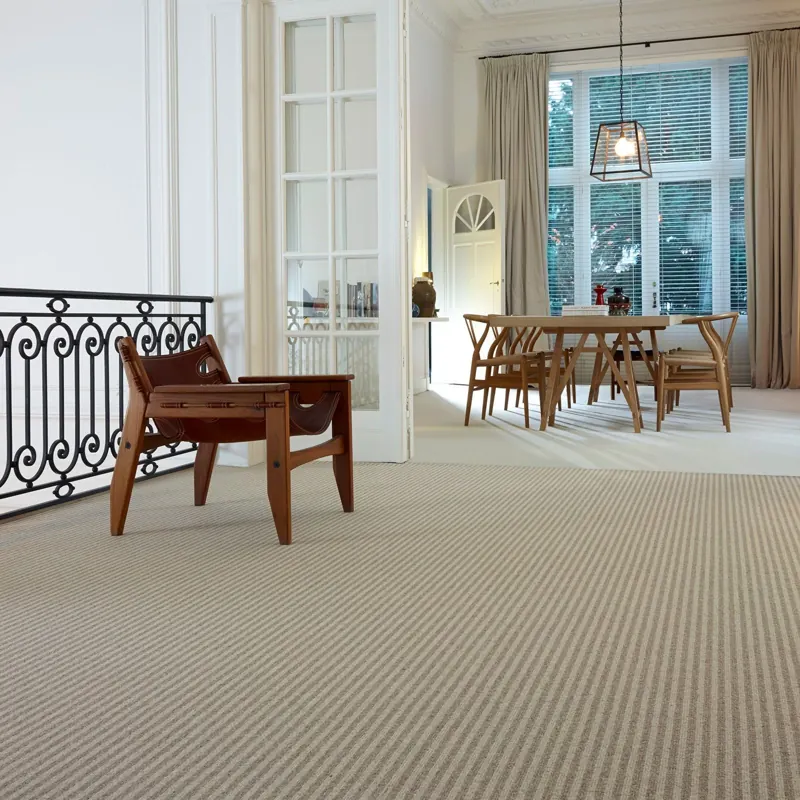 Modern beige striped carpet in a spacious landing and dining area.