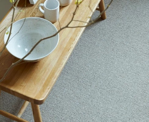 Modern grey wool carpet in a living room setting