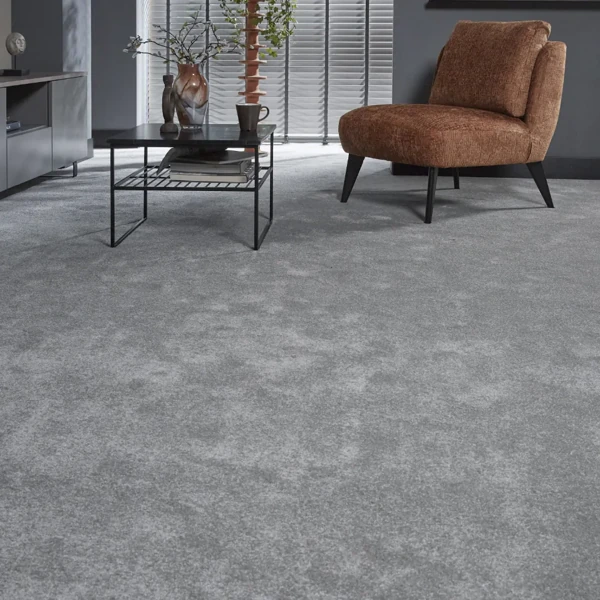 Plush grey saxony wool carpet in a modern living room
