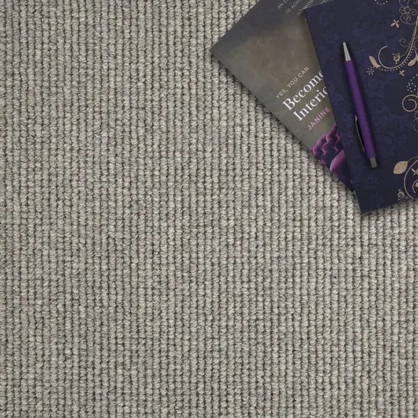 grey loop pile wool carpet with a uniform ribbed texture.